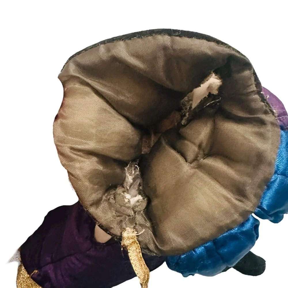 Elegant Purple and Gold Doll with Blue Outfit
